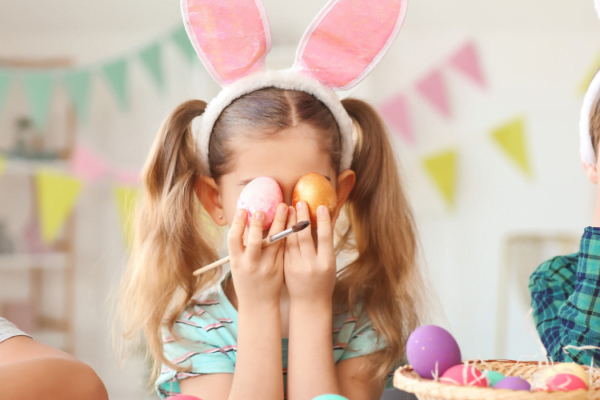 Children posing with easter eggs