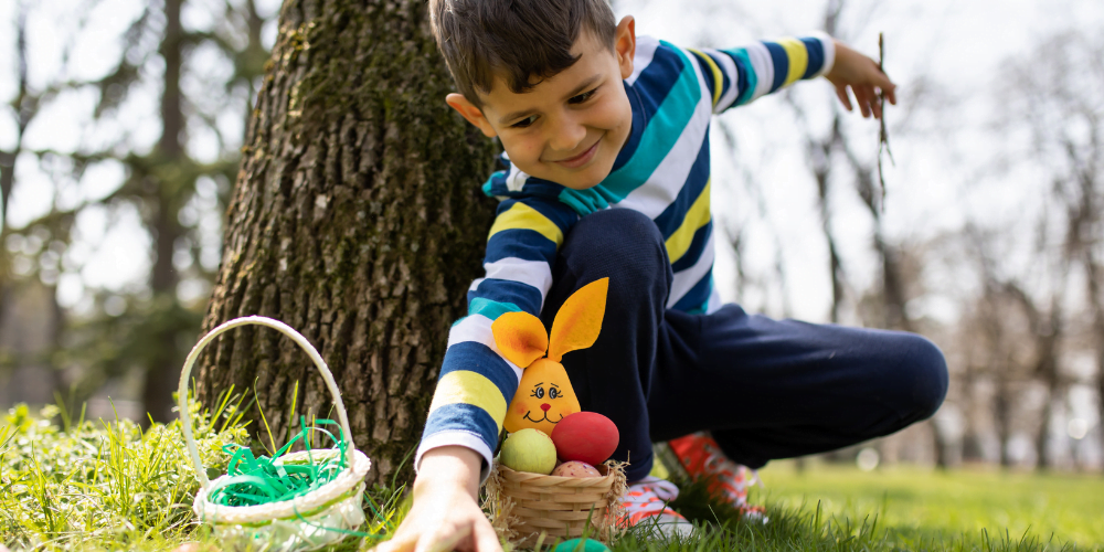 A child taking part in an Easter Egg hunt