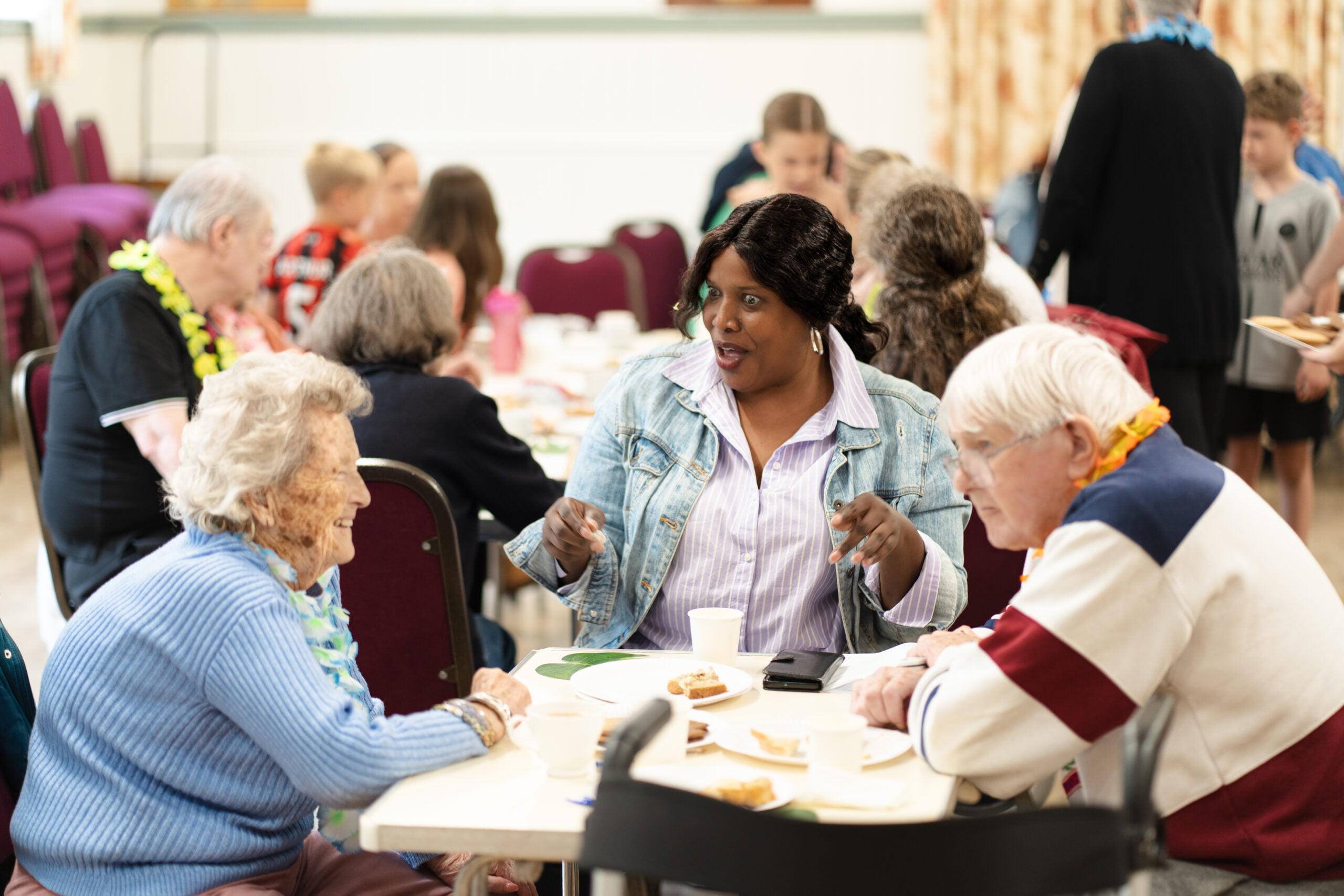 Care Worker and Clients at a tea party