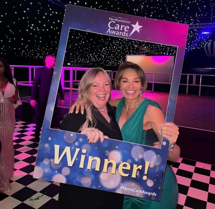 Camille celebrates winning at the HCPA Awards