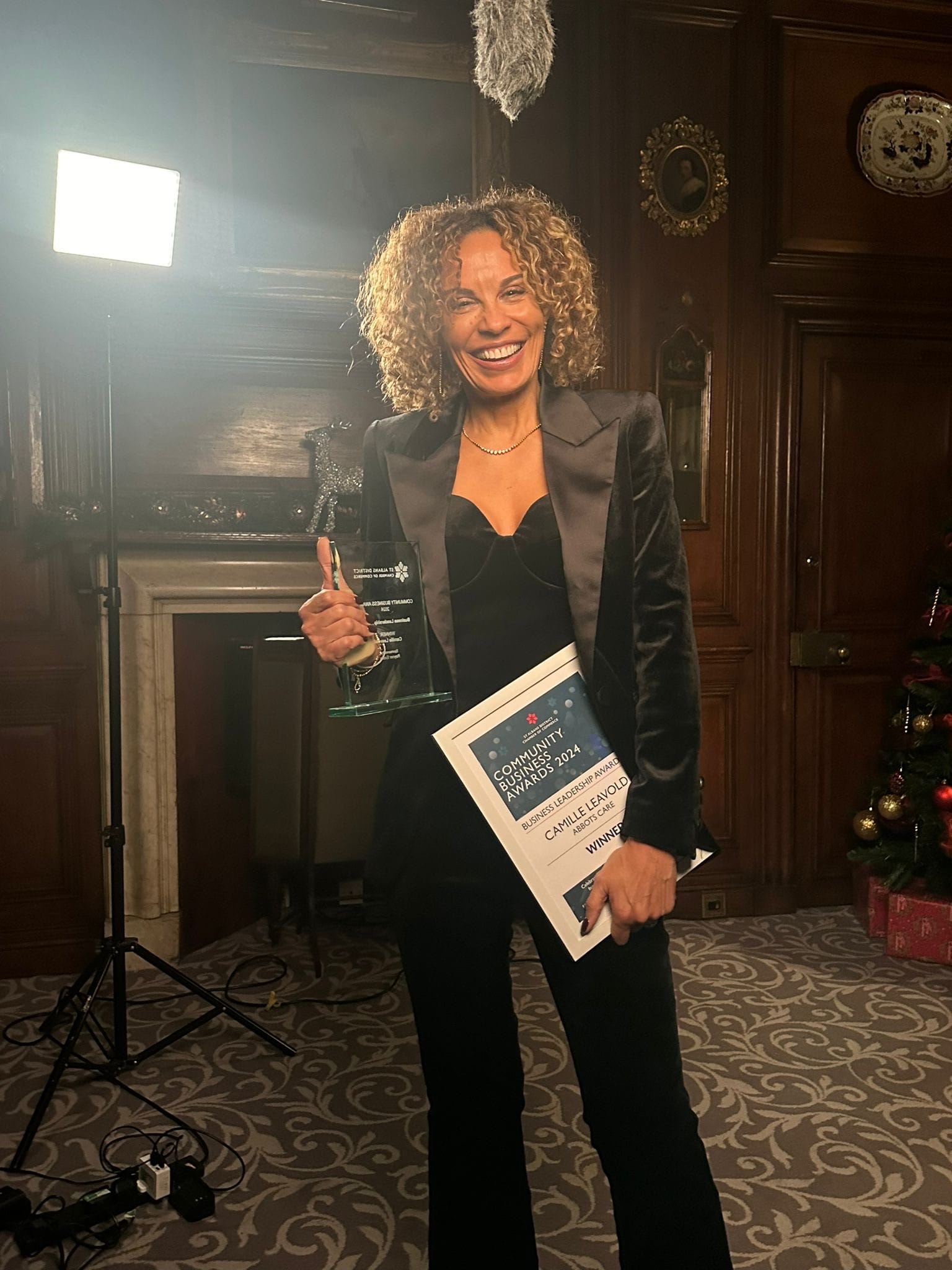 Camille Leavold poses with her leadership award at the Community Business Awards