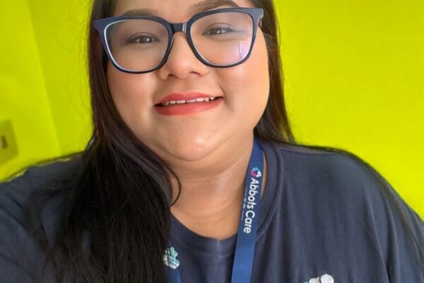 Abbots Care Worker Kriti posing in uniform