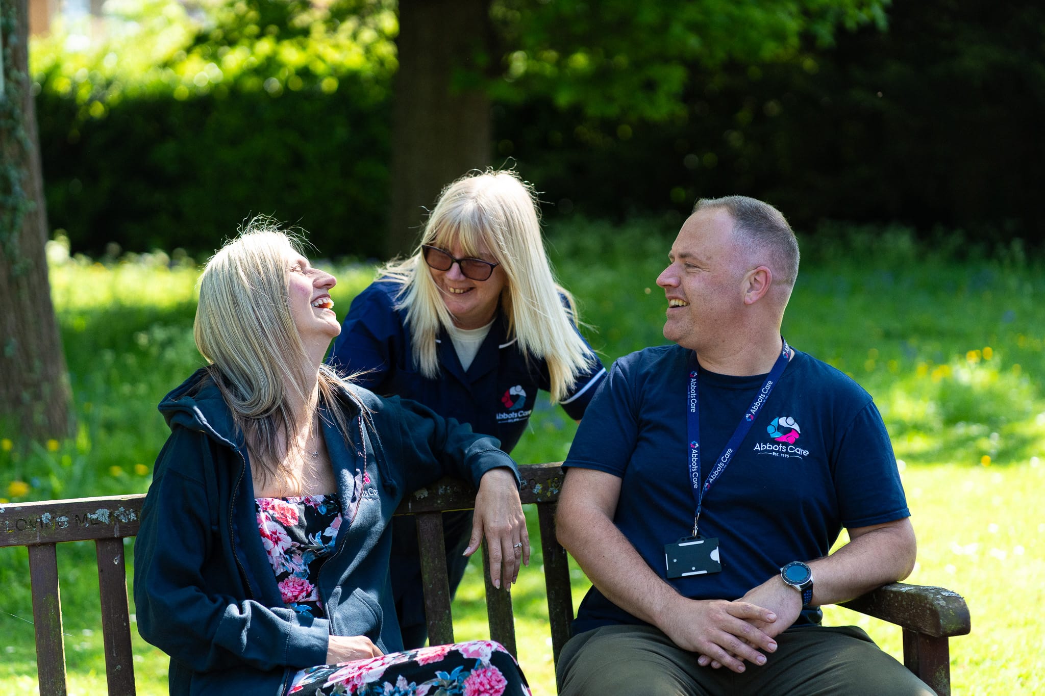 Abbots Care Workers sitting and chatting in the sun