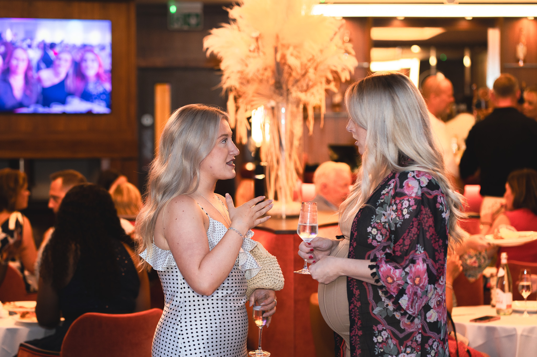 Hannah and Sophie from Abbots Care marketing team have a discussion at the Abbots Care 30th birthday celebrations