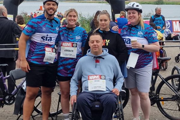 Abbots Care team members posing together before starting the Superhero Triathlon