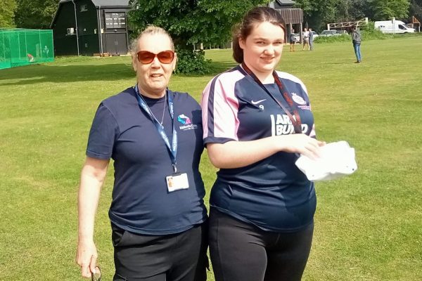 Care Worker Maggie and Client Rosie outside on a sunny day