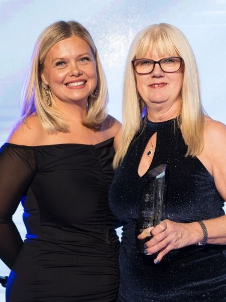 Tina winning the heart of gold award at the Abbots Care Worker Awards 2025